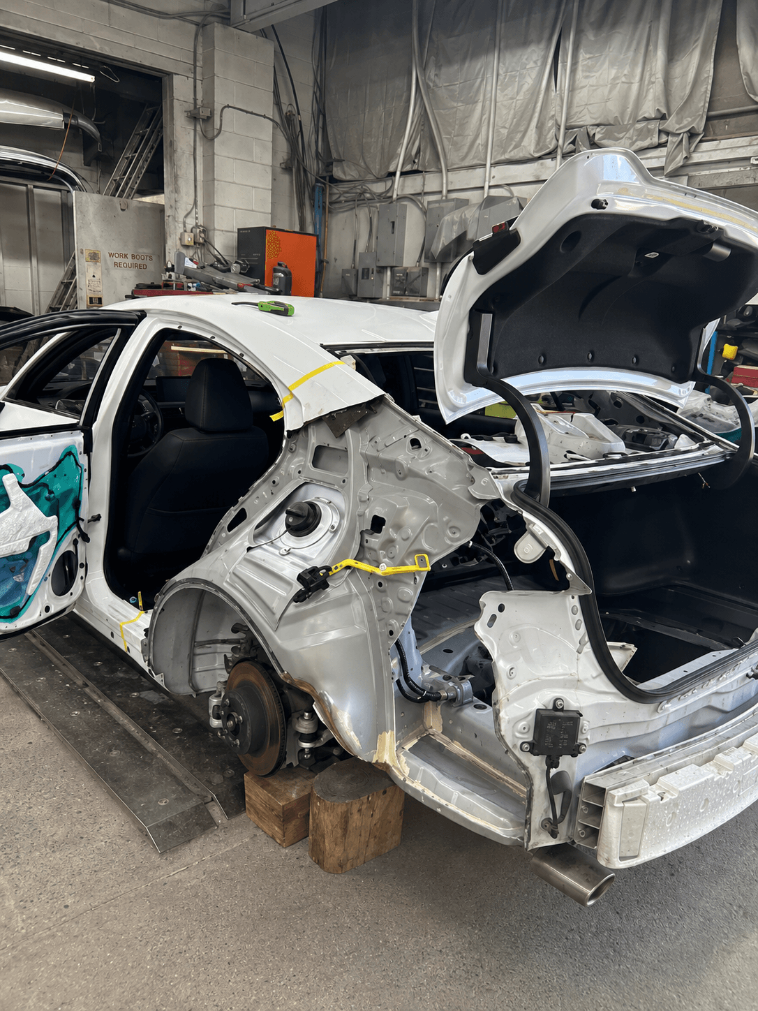 Vehicle before repair, showing collision damage
